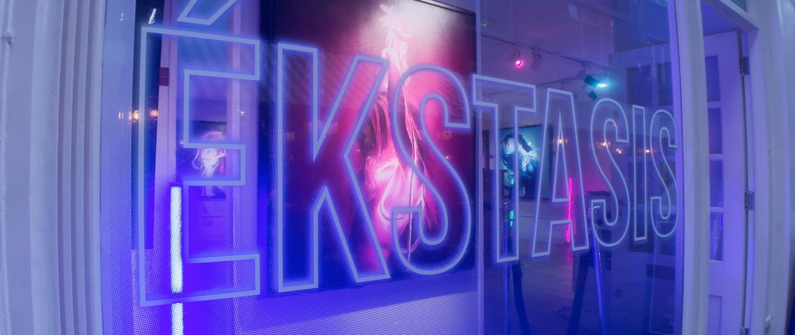 Signage for the ÉKSTASIS exhibition in London