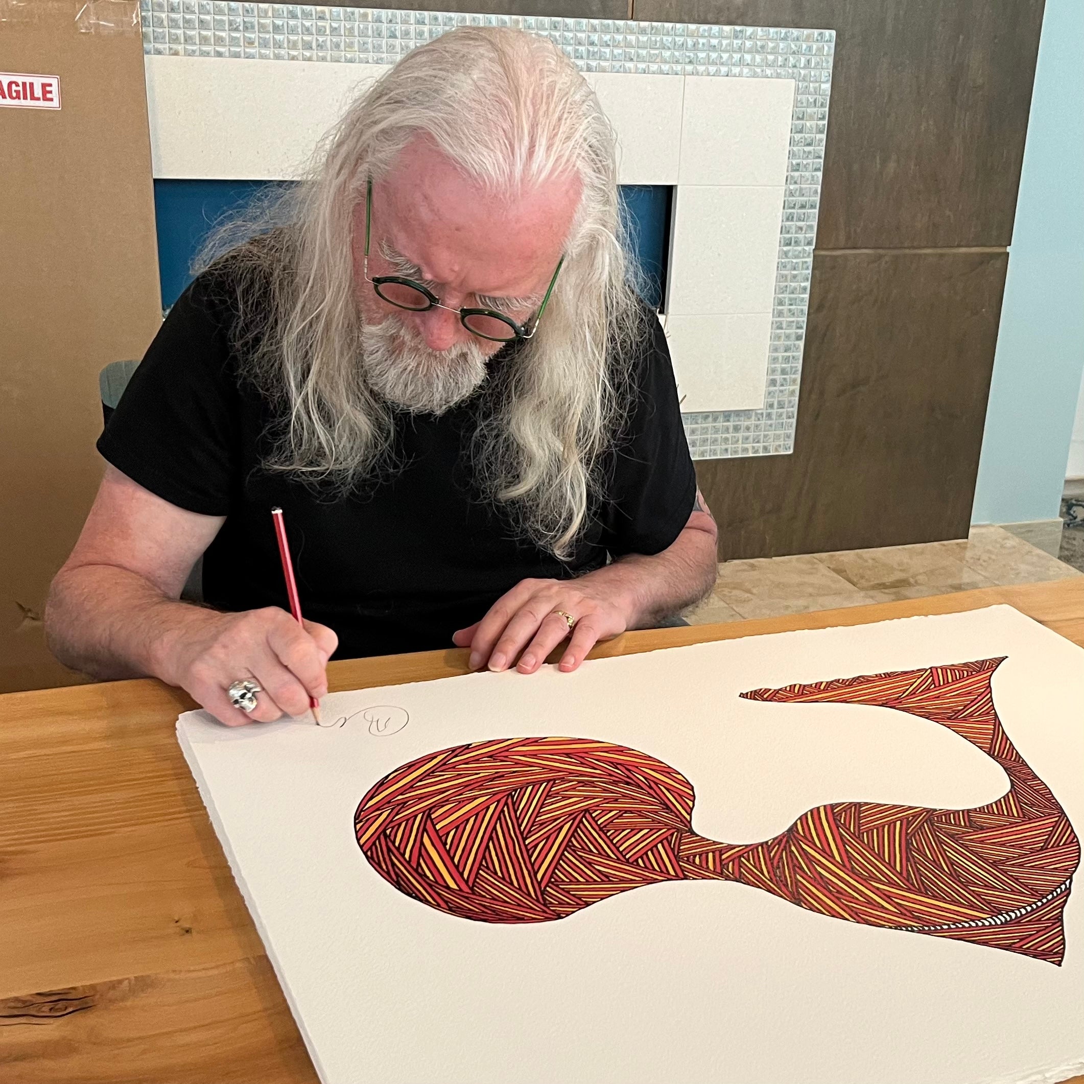 Billy Connolly signing artwork