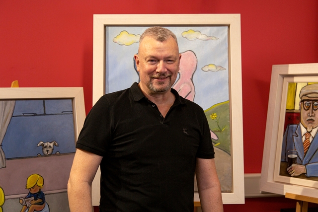 Stephen Roby pictured with his orignal artworks, which he paints in oil on canvas 